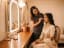 A makeup artist finishing a bride's look before an event